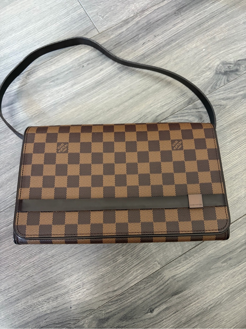 Louis Vuitton Damier Ebene Tribeca Long with authentication.